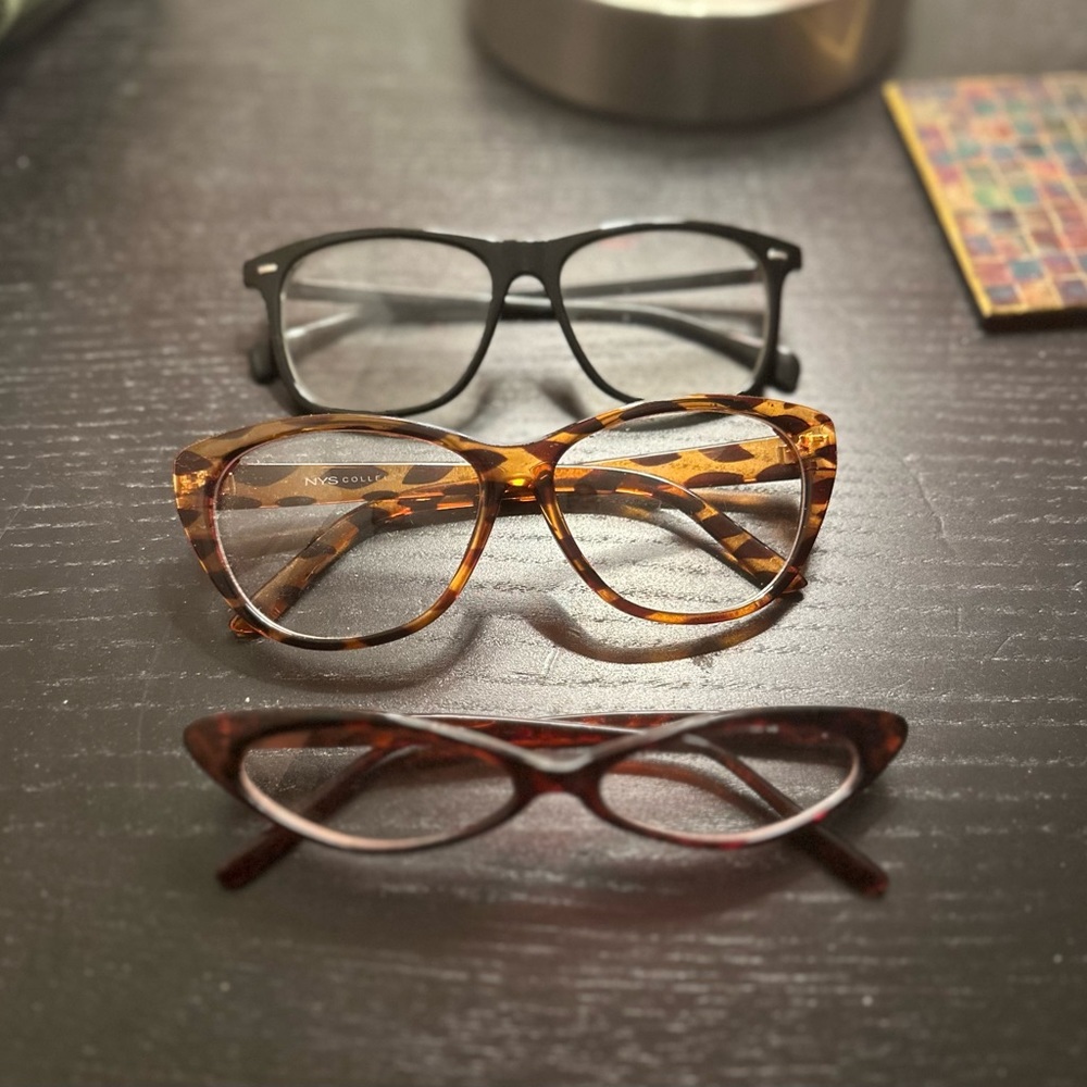 Three pairs of gently worn non prescription  glasses just because.